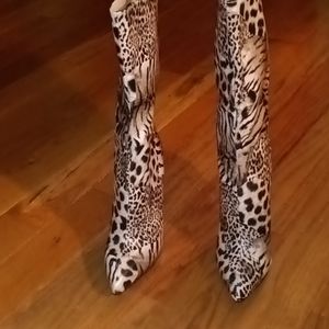 Brand new size 7 high heel boots leopard